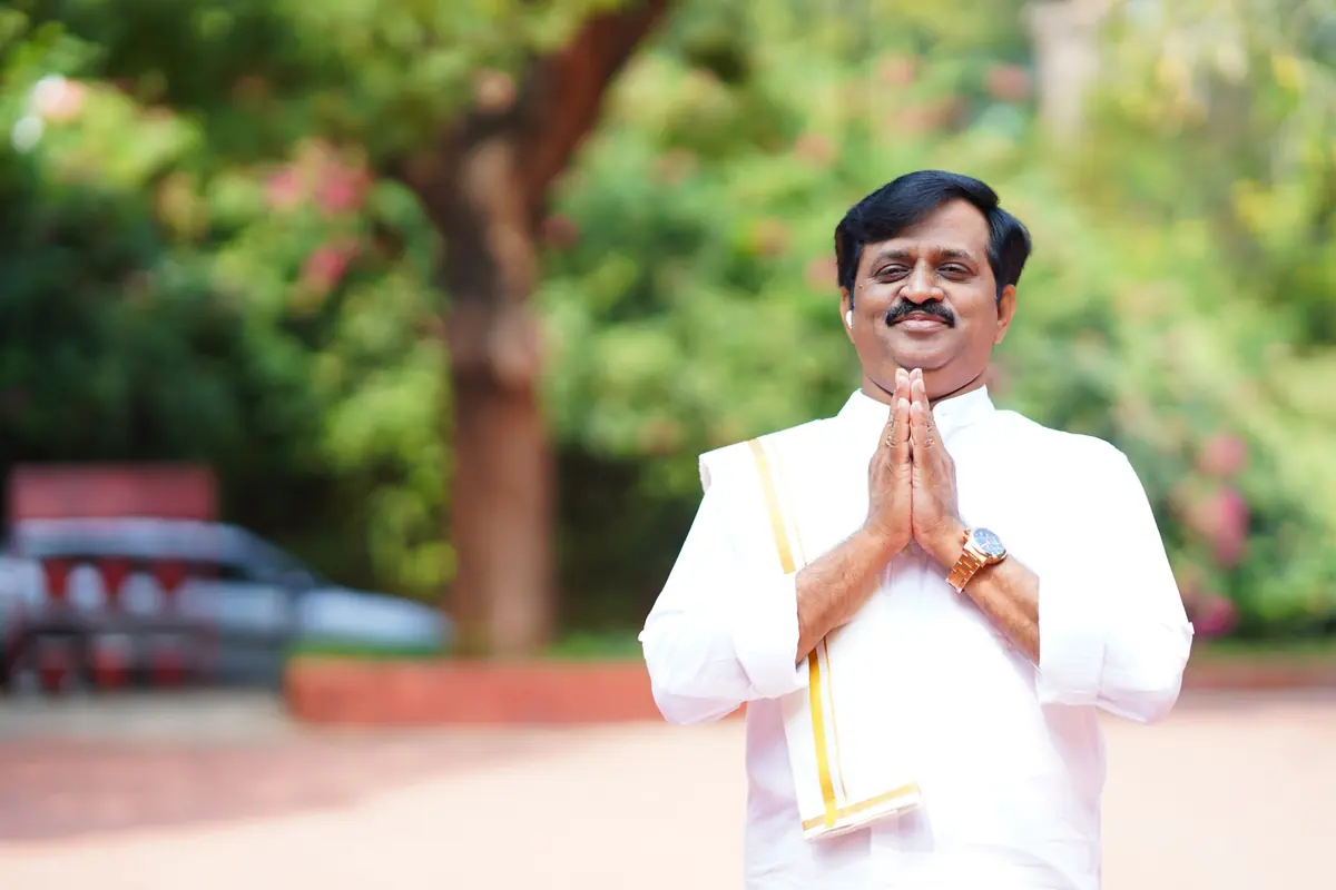 Surekaa Sundar in a white veshti, greeting with folded hands