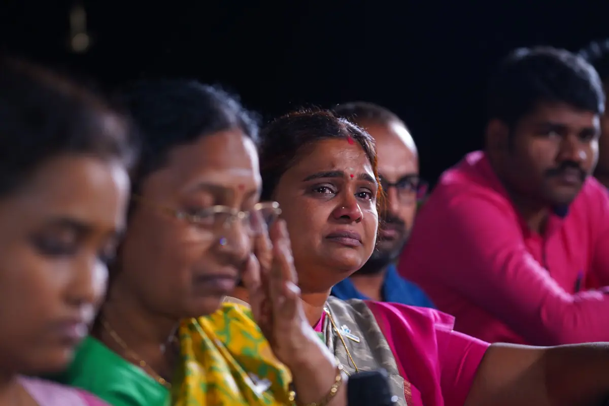Participants wiping away tears during an evening session